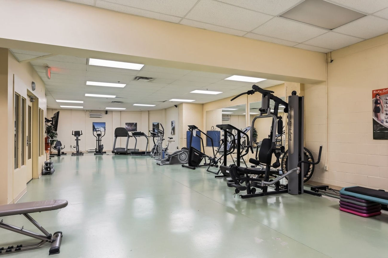 Exercise room with treadmills and weight equipment